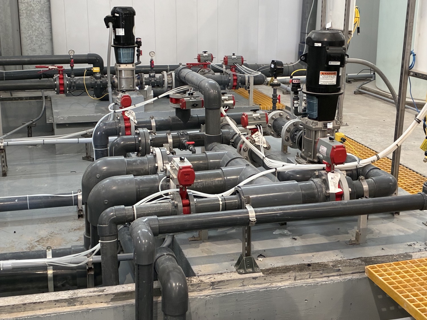Detailed view of industrial piping, valves, and instrumentation