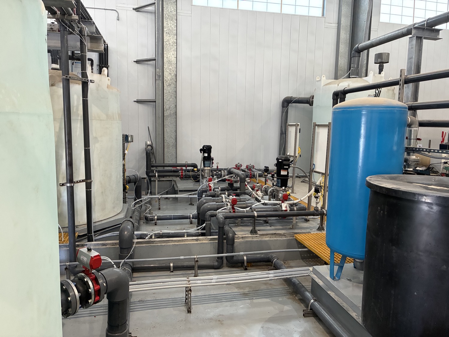 Industrial tanks, pumps, and complex piping arrangement